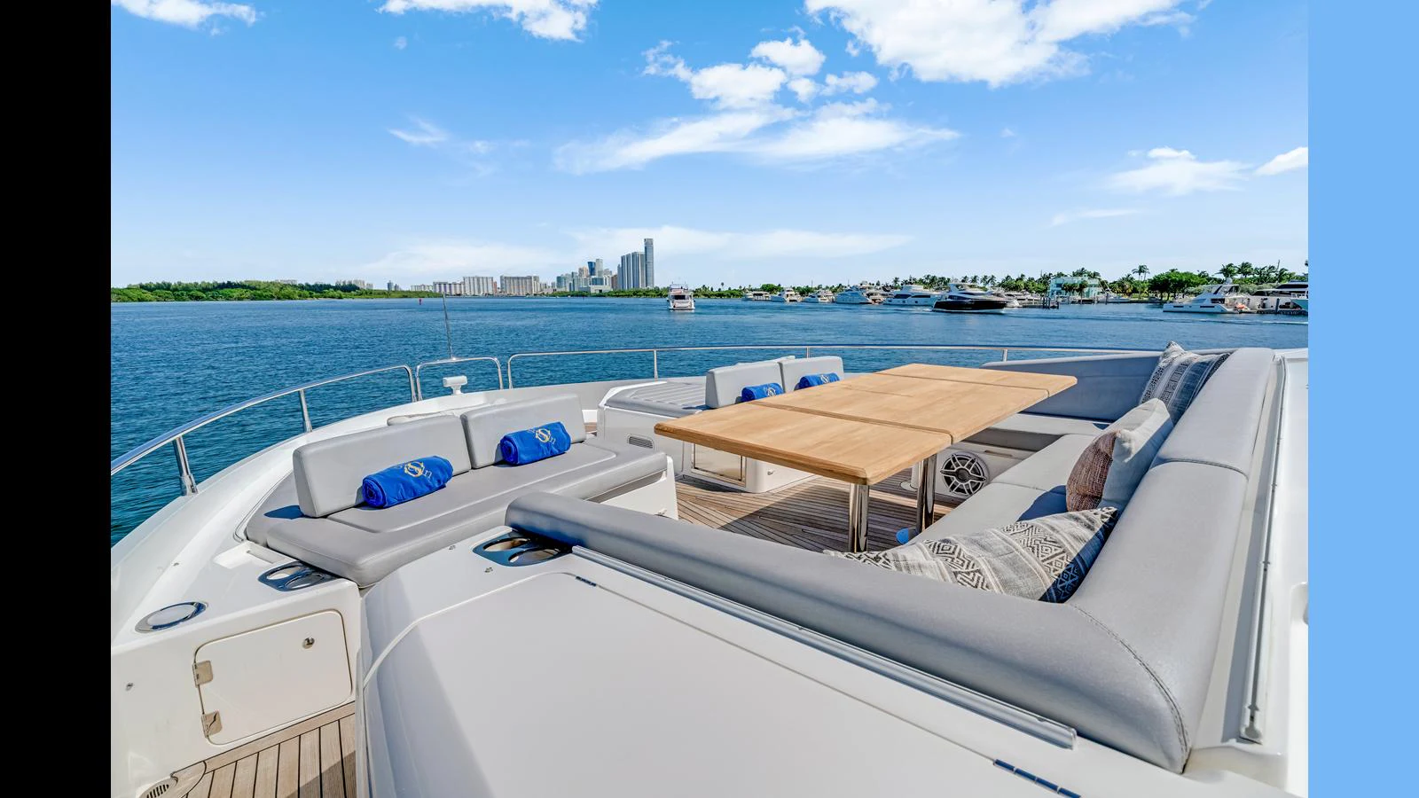 The sundeck offers a spacious seating area with a large table, perfect for outdoor dining and relaxation. aboard STEELN Yacht for Sale