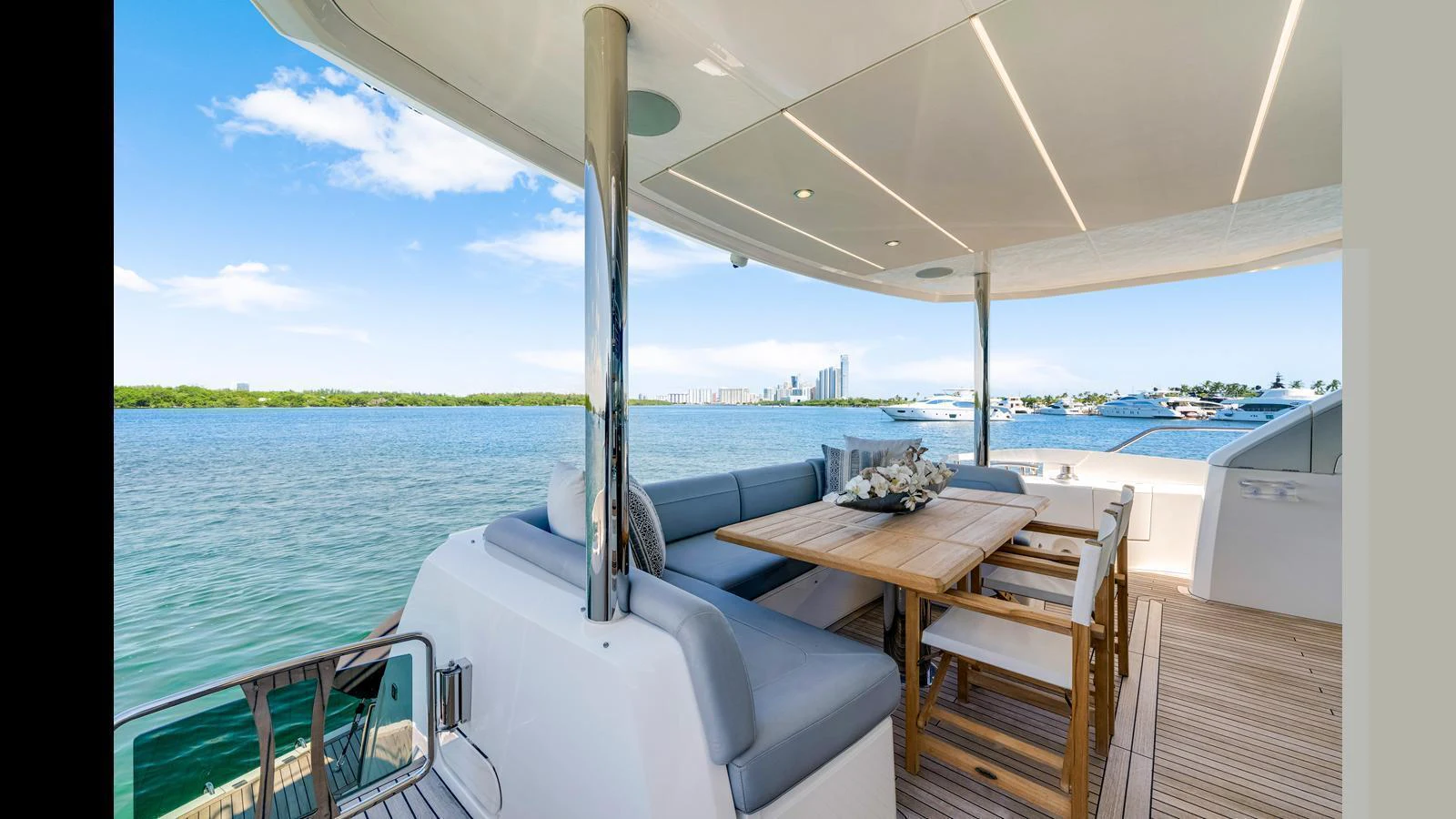 The aft deck offers a luxurious outdoor dining area with stunning views of the water. aboard STEELN Yacht for Sale