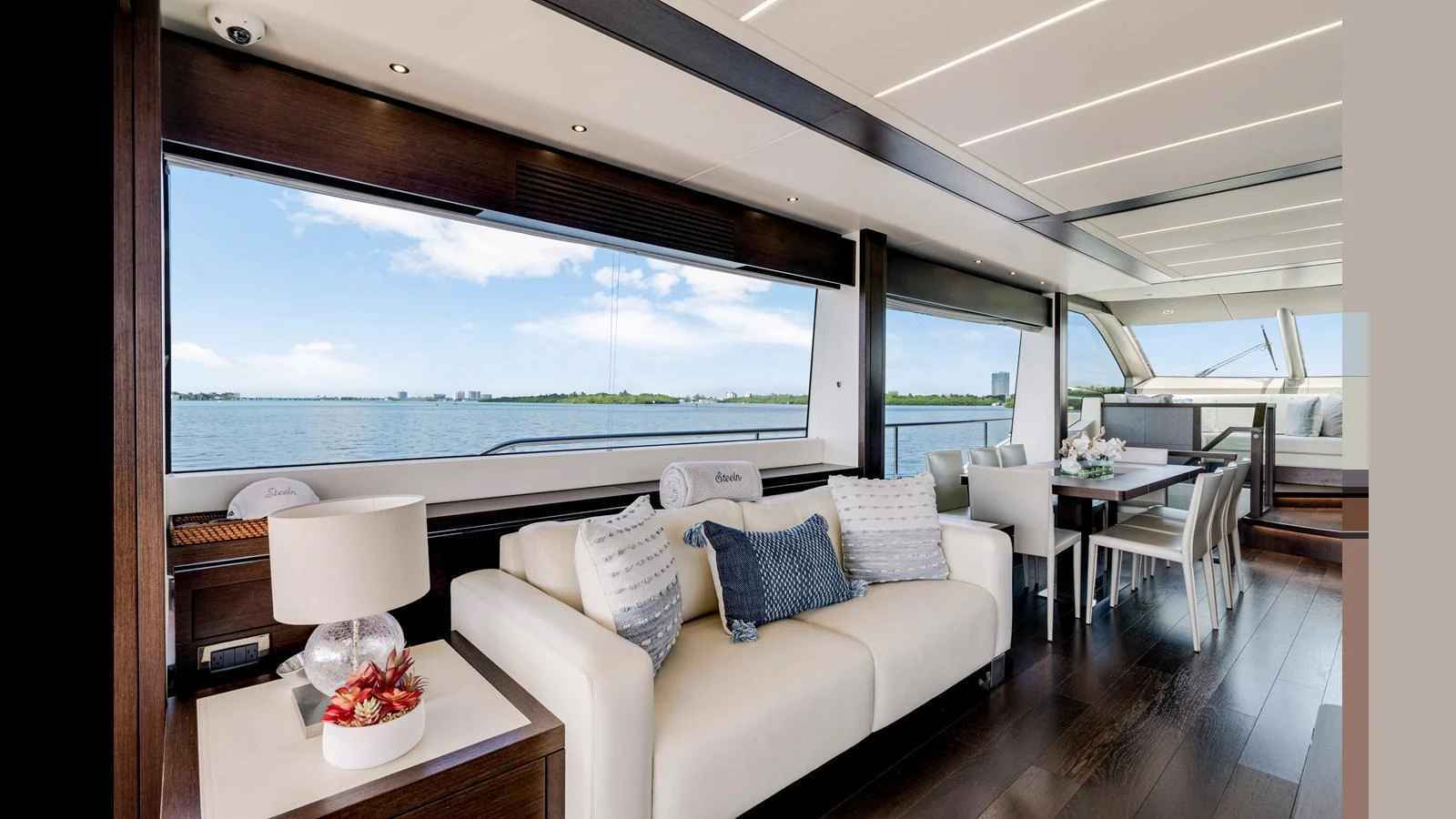 The salon offers a luxurious and spacious area with large windows providing stunning ocean views. aboard STEELN Yacht for Sale