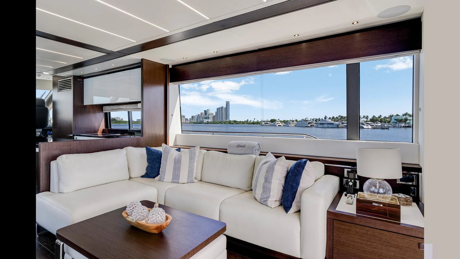 The salon features a spacious seating area with large windows offering stunning views. aboard STEELN Yacht for Sale