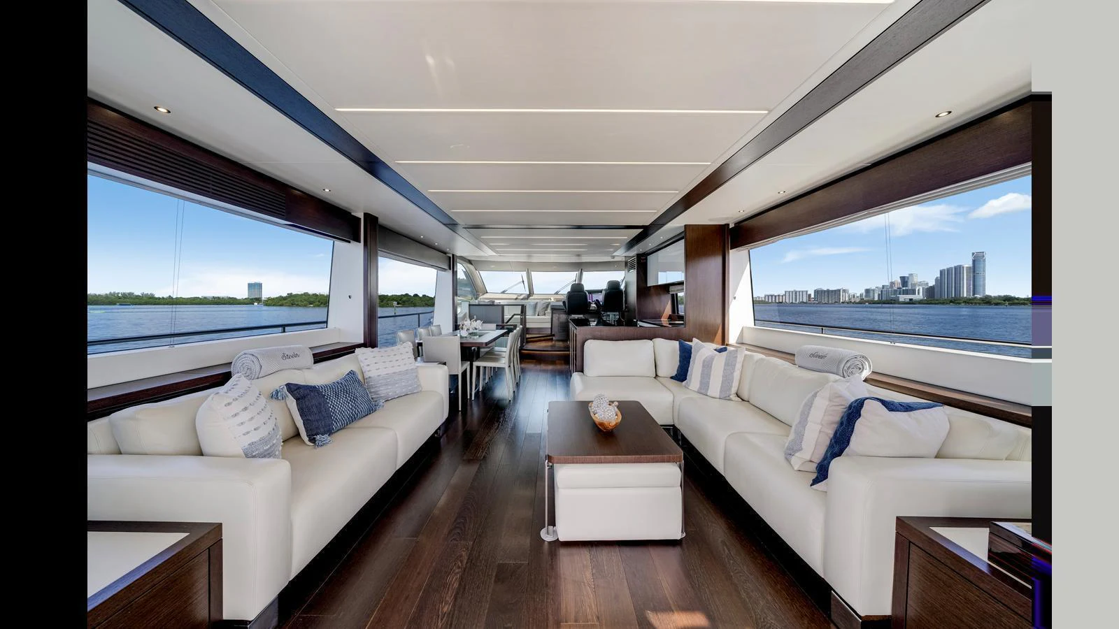 The salon offers a spacious and elegant area with large windows providing stunning views. aboard STEELN Yacht for Sale