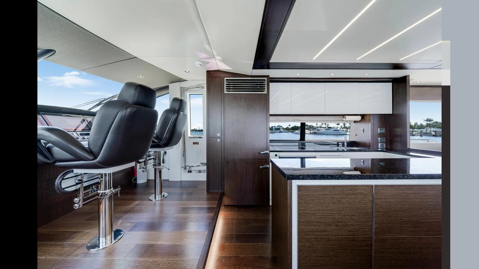 The yacht's helm area features sleek, modern design with comfortable seating and state-of-the-art controls. aboard STEELN Yacht for Sale
