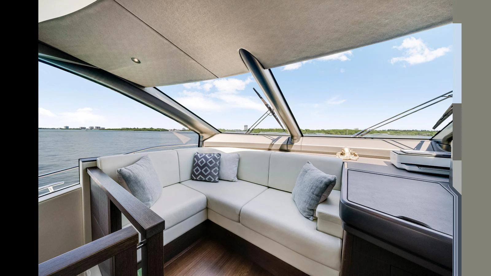 The salon offers a comfortable seating area with a panoramic view of the water. aboard STEELN Yacht for Sale