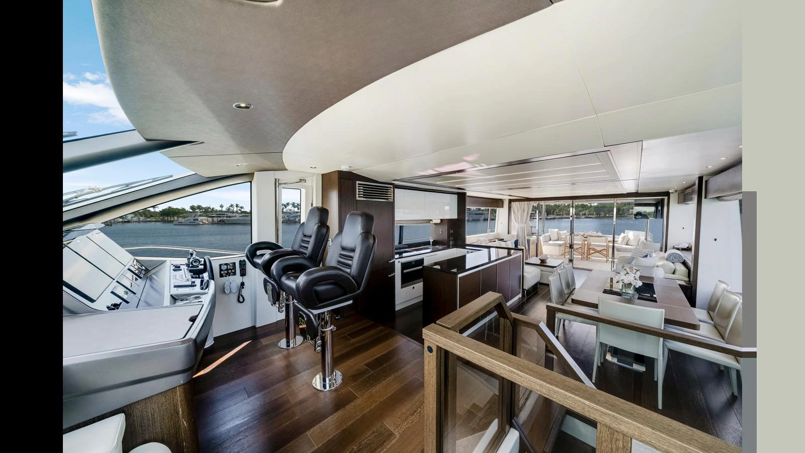 The yacht's helm area features a modern, open-plan design with expansive views and luxurious seating. aboard STEELN Yacht for Sale