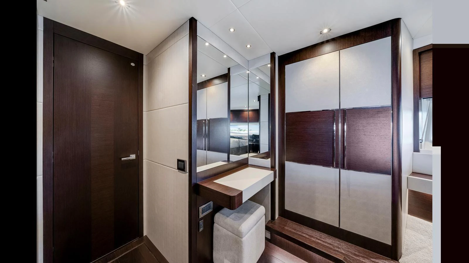 The stateroom features elegant wood finishes and modern lighting, creating a luxurious and inviting atmosphere. aboard STEELN Yacht for Sale