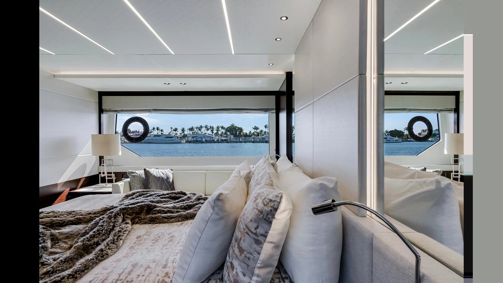 The stateroom offers a luxurious and serene space with large windows providing a stunning view of the water. aboard STEELN Yacht for Sale
