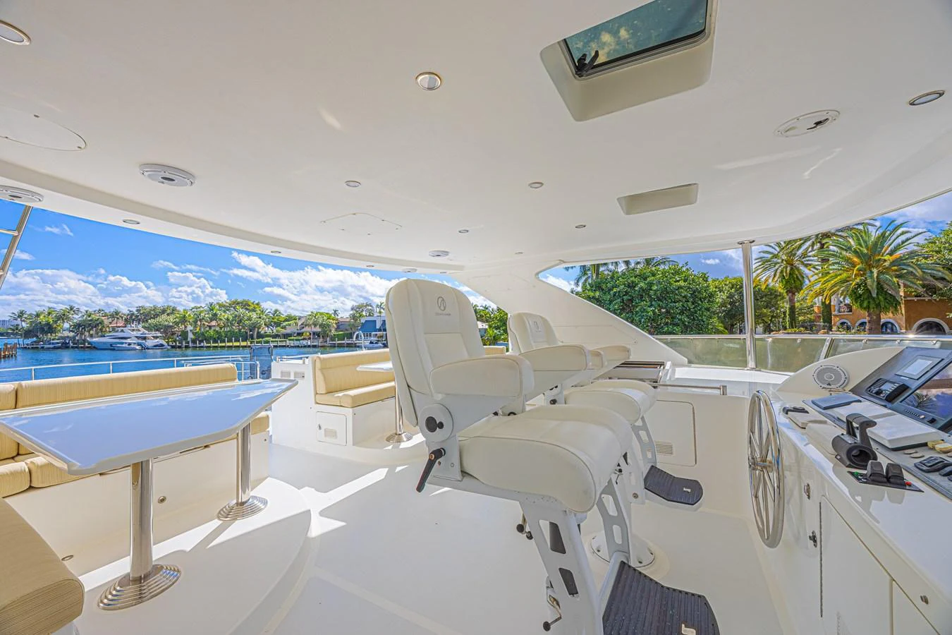 The helm area offers a spacious and bright environment with comfortable seating and a panoramic view. aboard MARGARITA Yacht for Sale