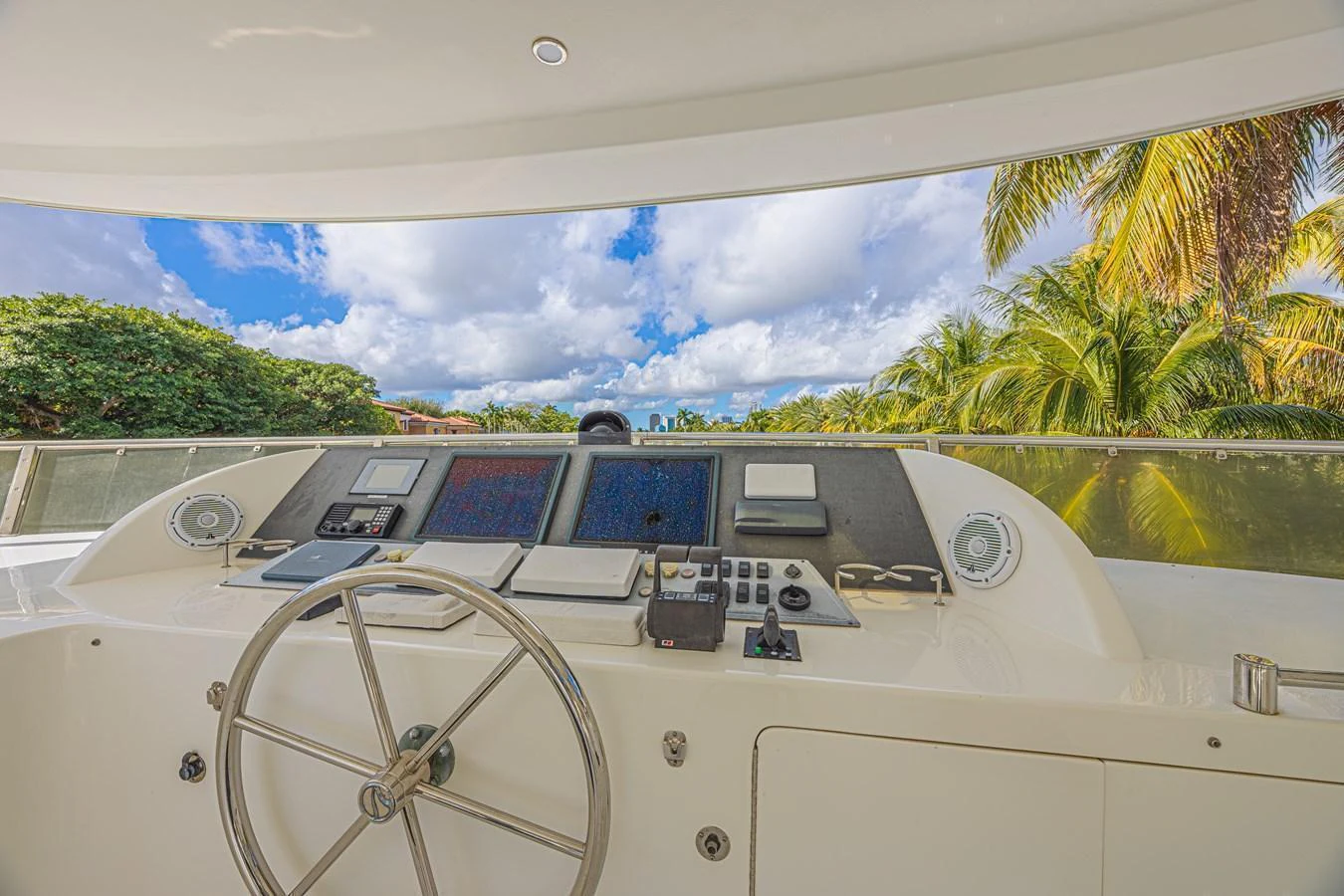 The helm station offers a commanding view with state-of-the-art navigation equipment and a sleek steering wheel. aboard MARGARITA Yacht for Sale