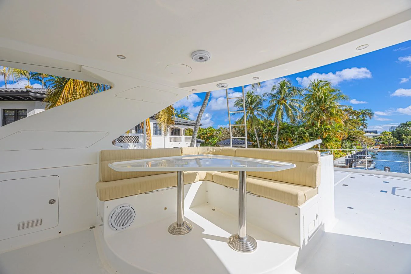 The aft deck features a cozy seating area with a table, perfect for alfresco dining. aboard MARGARITA Yacht for Sale