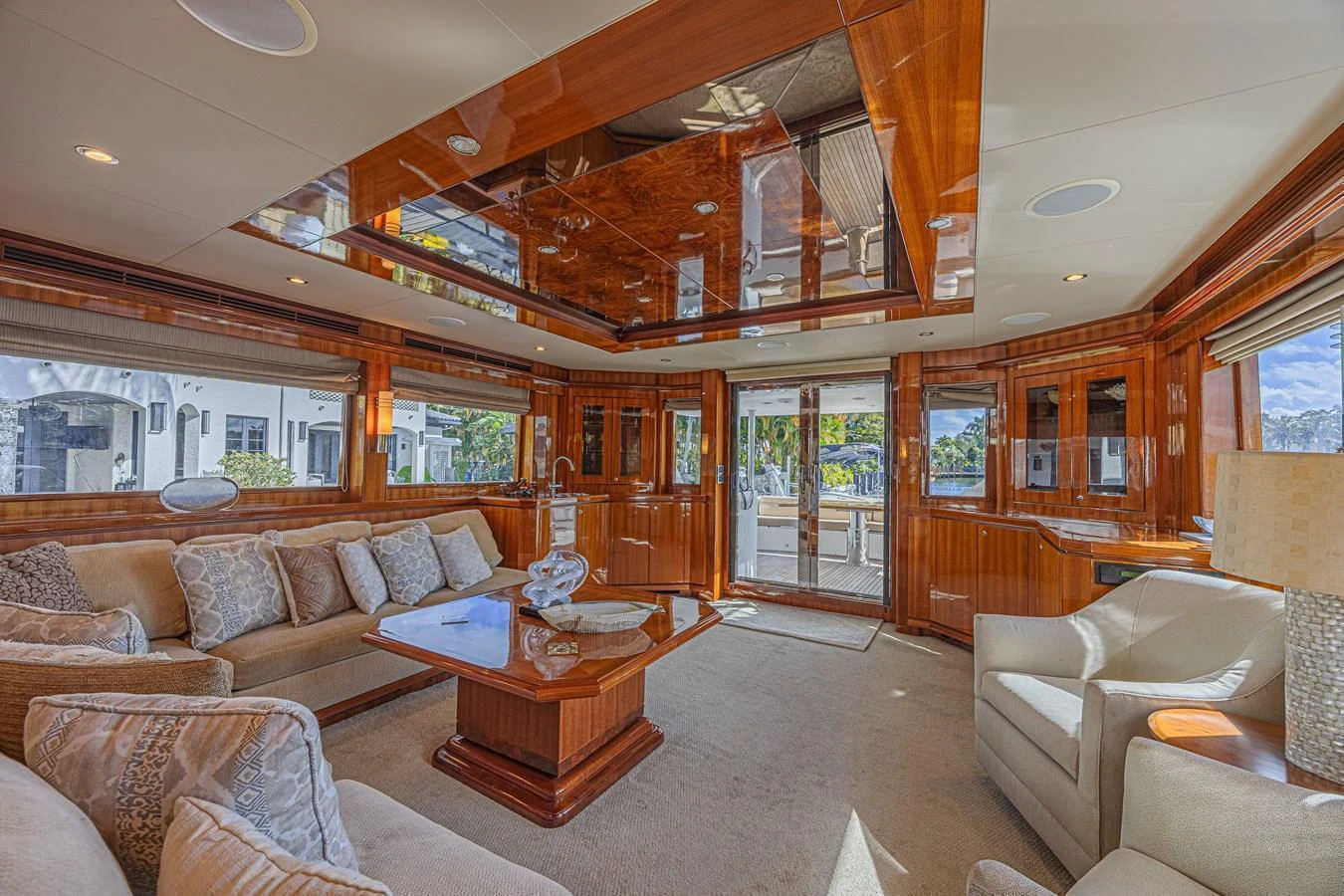 The salon features luxurious seating and elegant wood finishes, creating a warm and inviting atmosphere. aboard MARGARITA Yacht for Sale