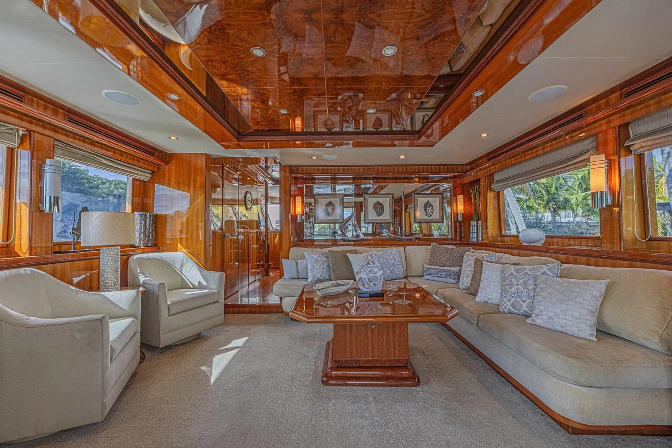 The yacht's salon features luxurious seating with ample natural light and elegant wooden finishes. aboard MARGARITA Yacht for Sale
