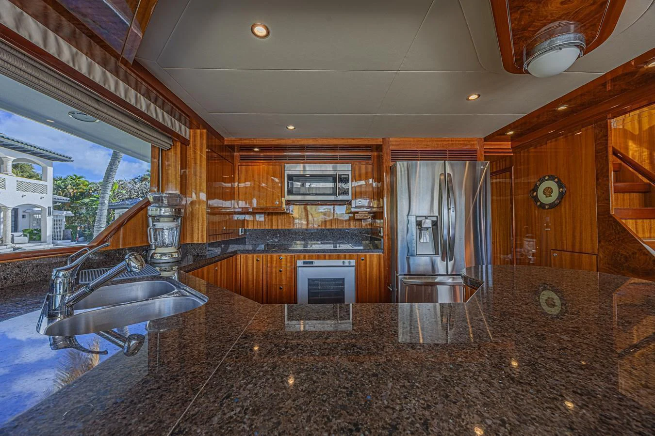 The yacht's galley features modern appliances and a sleek granite countertop, creating a luxurious and functional space. aboard MARGARITA Yacht for Sale
