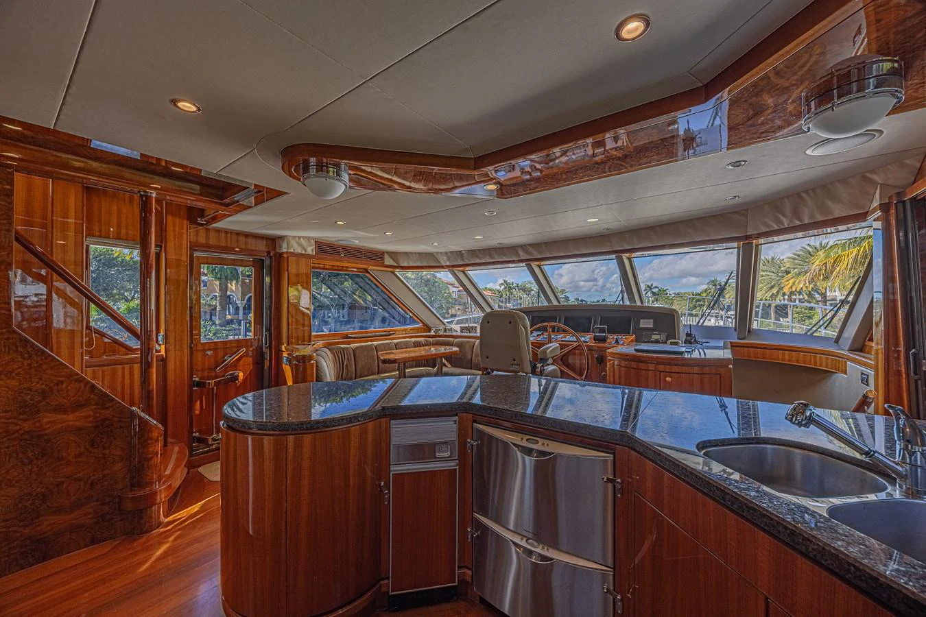 The yacht's galley features elegant wood finishes and modern appliances, offering a luxurious space for culinary activities. aboard MARGARITA Yacht for Sale
