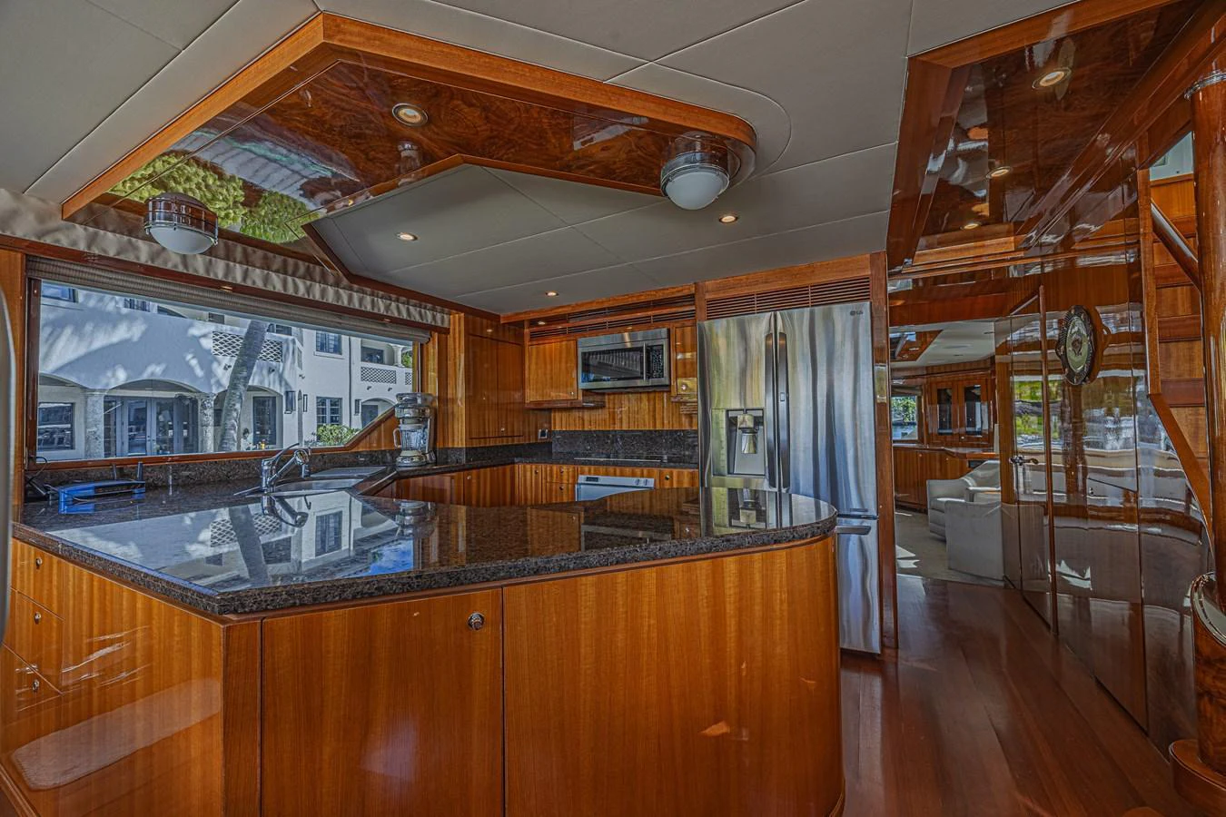 The yacht's galley features polished wood cabinetry and modern stainless steel appliances. aboard MARGARITA Yacht for Sale