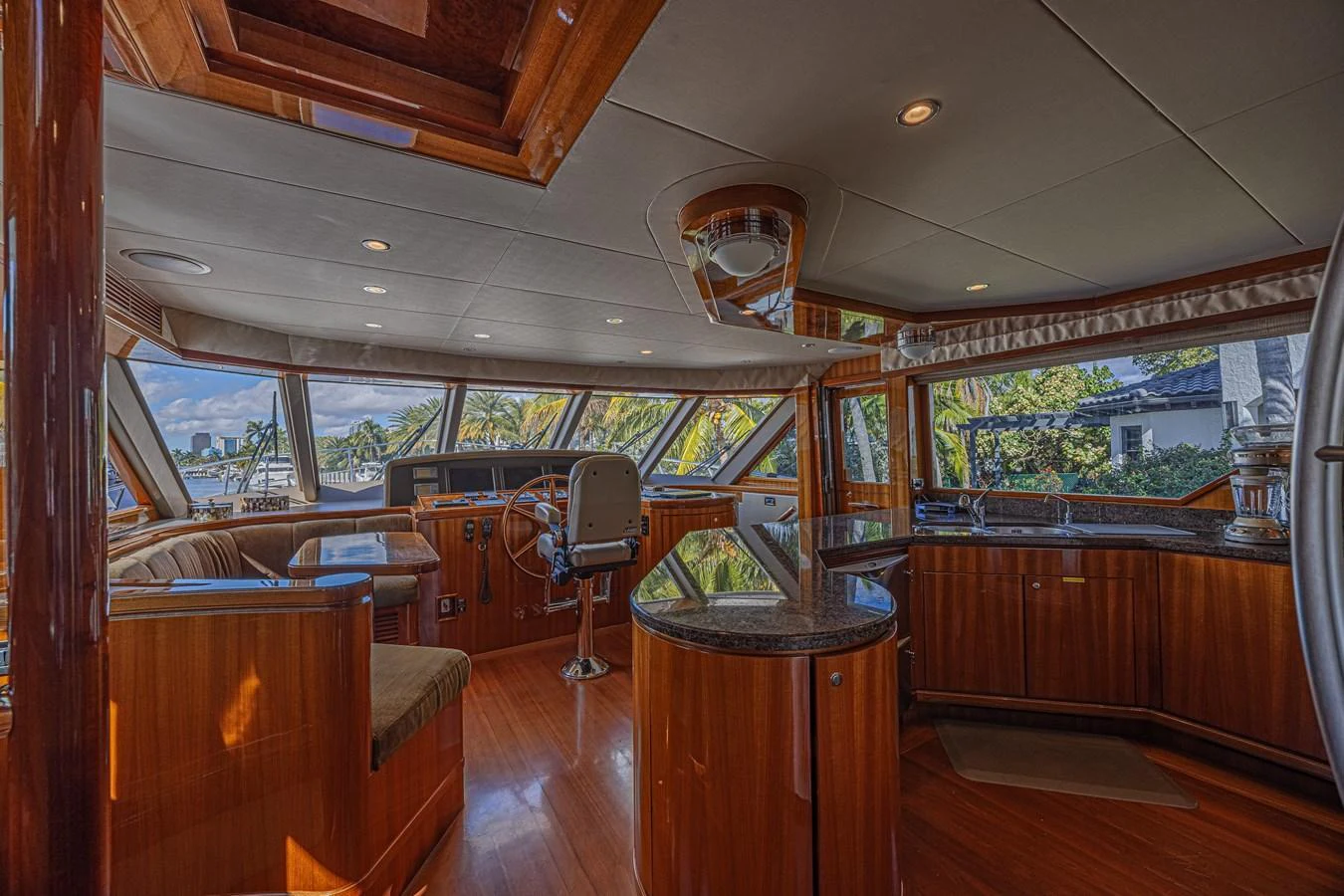 The helm area features luxurious wood finishes and panoramic windows offering stunning views. aboard MARGARITA Yacht for Sale