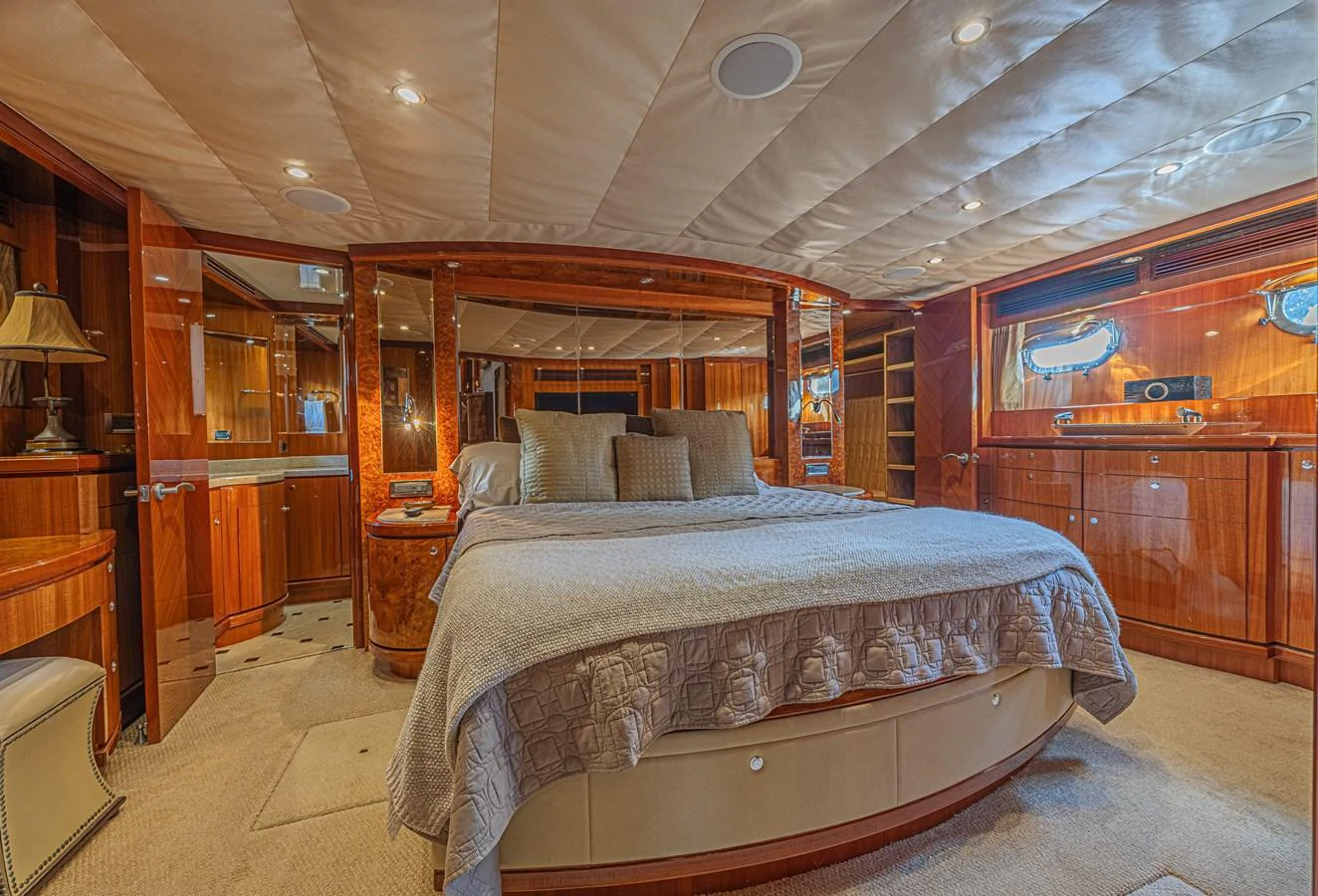 The master stateroom exudes luxury with its spacious layout and elegant wood finishes. aboard MARGARITA Yacht for Sale