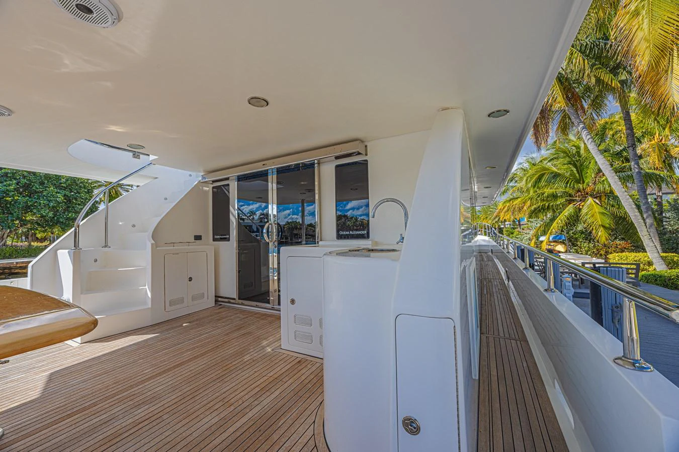 The side deck offers a spacious and elegant walkway with beautiful wood flooring and modern amenities. aboard MARGARITA Yacht for Sale