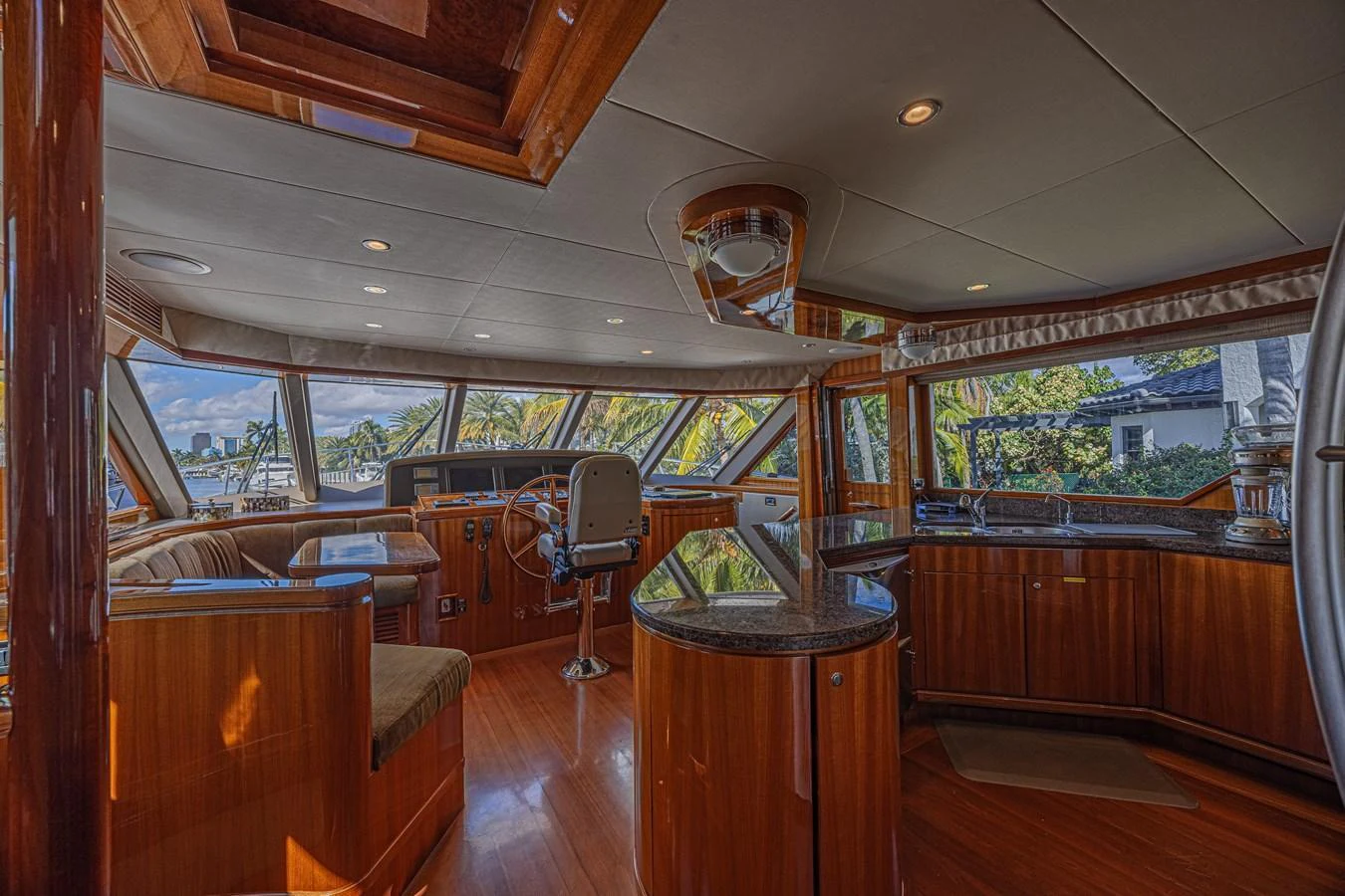 The helm area features luxurious wood finishes and panoramic windows for an exceptional view. aboard MARGARITA Yacht for Sale