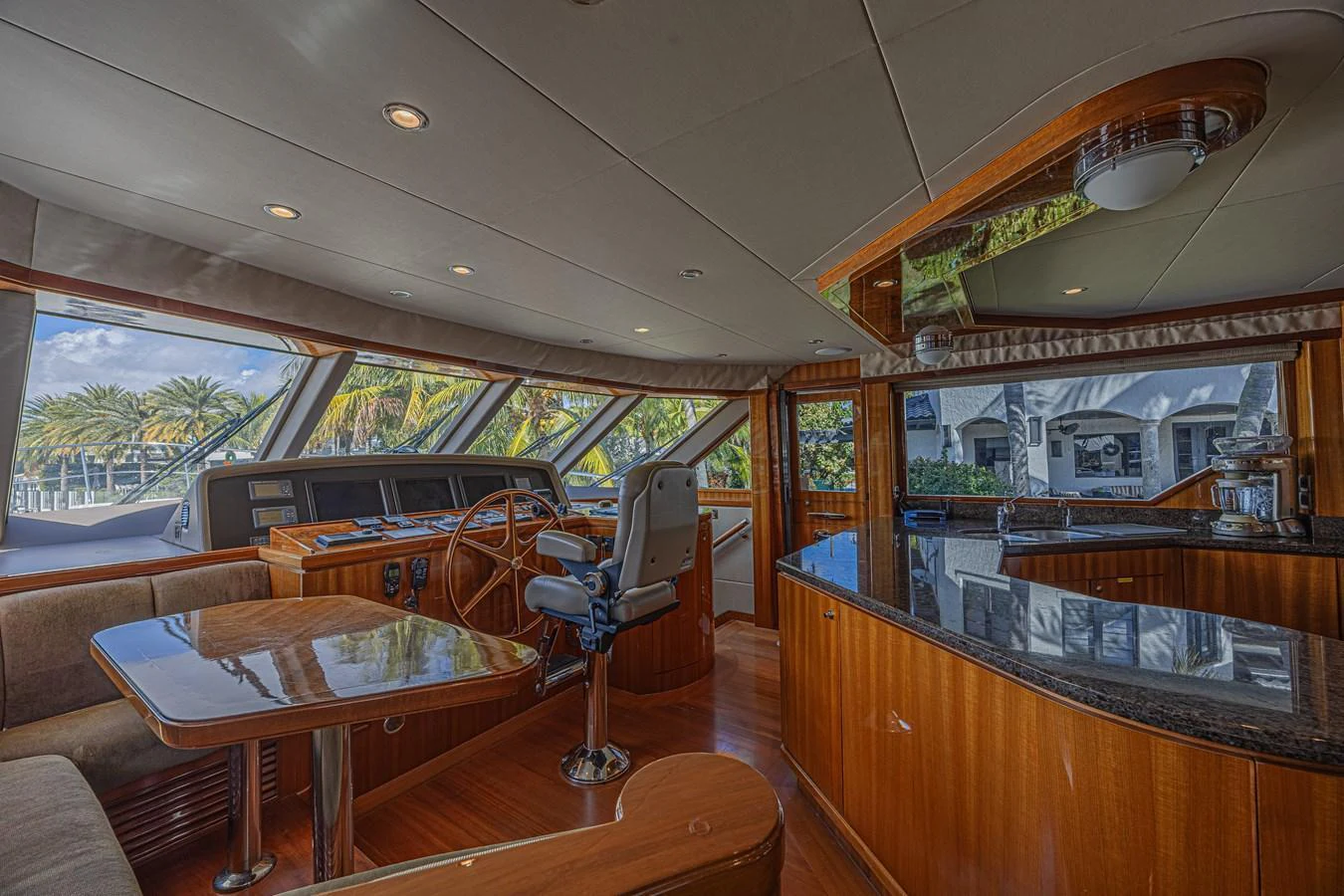 The helm area features a luxurious and spacious design with ample seating and a well-equipped control station. aboard MARGARITA Yacht for Sale