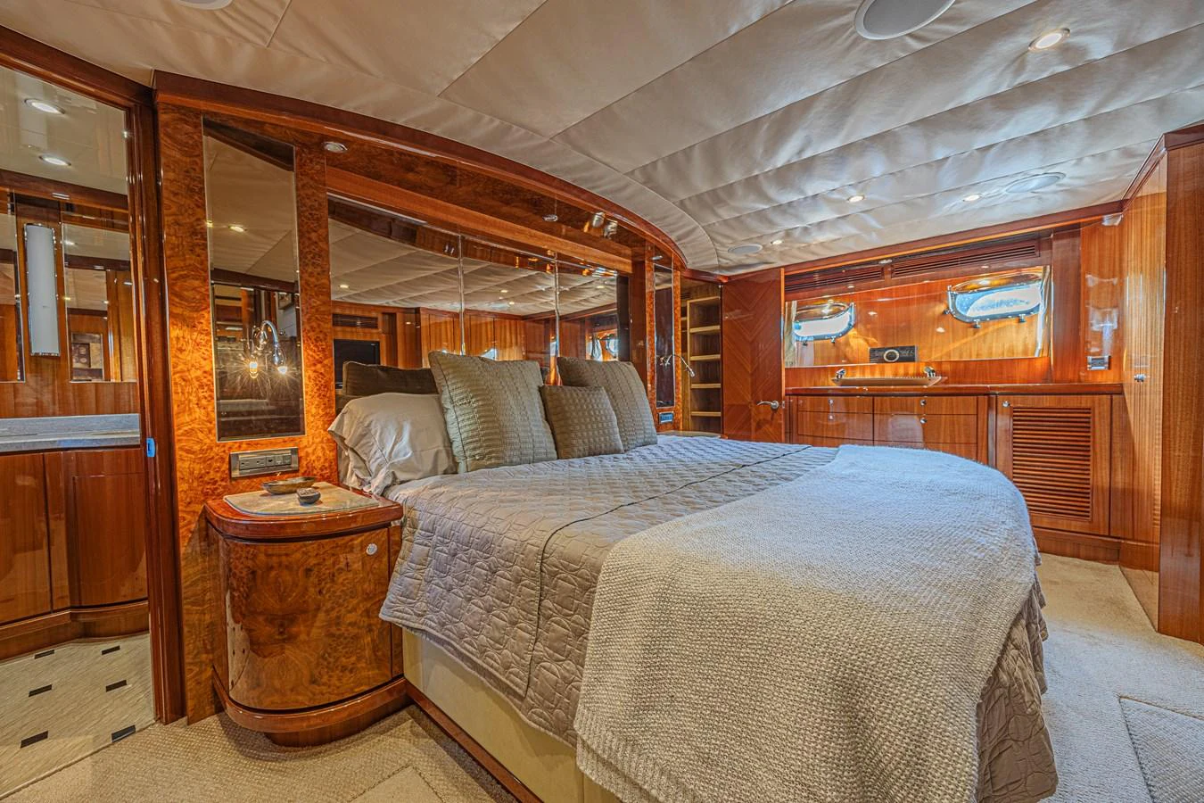 The master stateroom features luxurious wood paneling and a spacious, comfortable bed. aboard MARGARITA Yacht for Sale