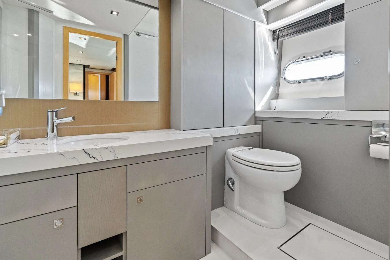 A sleek and modern bathroom with elegant fixtures and ample natural light. aboard IT'S ENOUGH Yacht for Sale