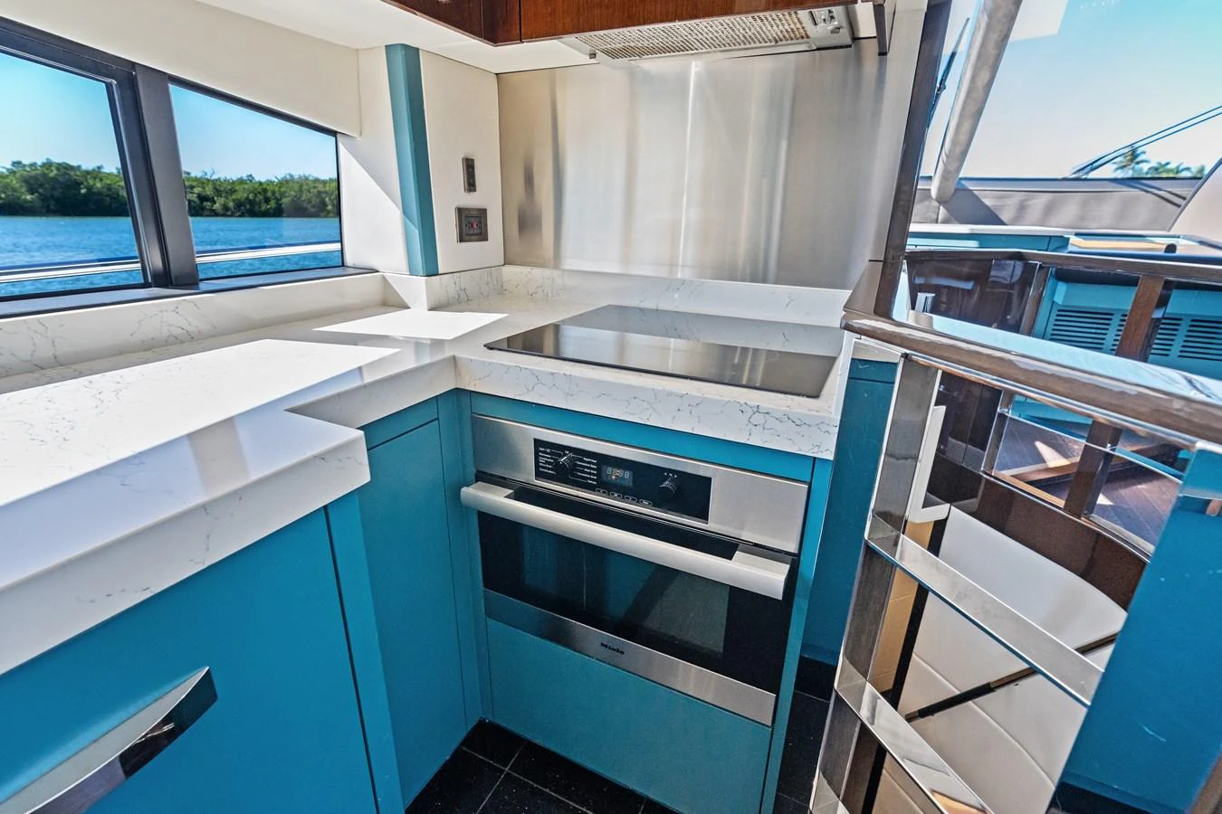 The yacht's galley features modern appliances and sleek countertops, offering a stylish and functional space for meal preparation. aboard IT'S ENOUGH Yacht for Sale