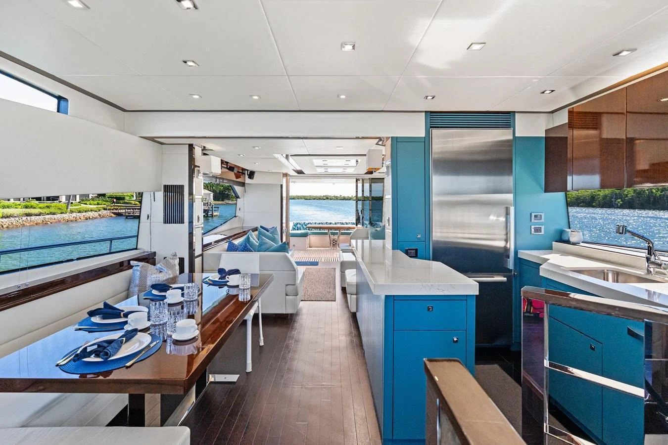 The galley features modern amenities and an open layout with a view of the water. aboard IT'S ENOUGH Yacht for Sale