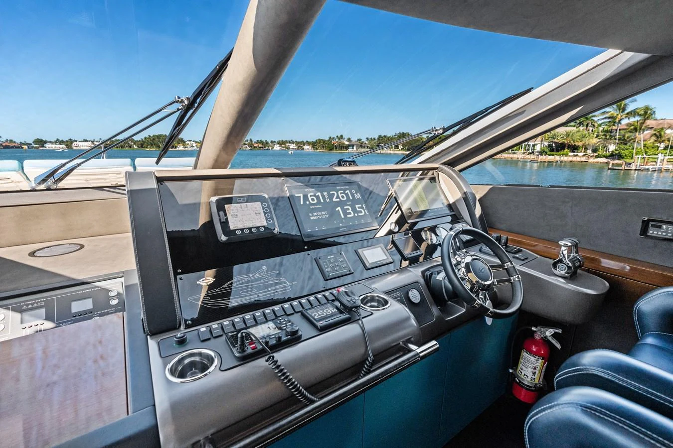 The helm station offers a sleek and modern control area with advanced navigation equipment and a panoramic view. aboard IT'S ENOUGH Yacht for Sale