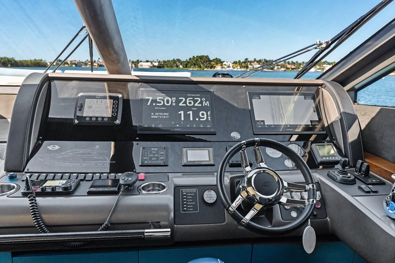 The helm station features advanced navigation equipment and a sleek steering wheel, offering a commanding view of the waters ahead. aboard IT'S ENOUGH Yacht for Sale
