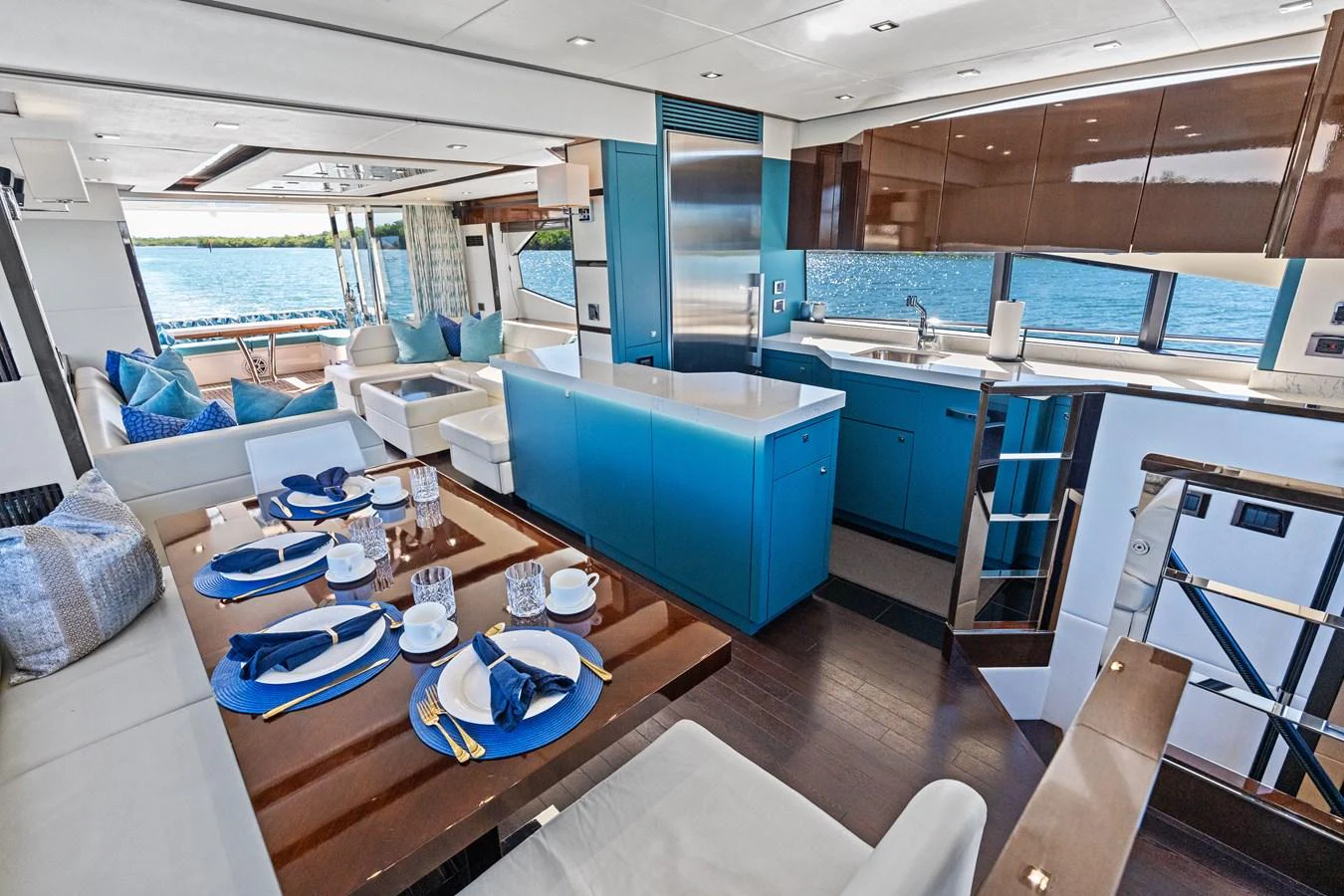 The yacht's galley features modern design with a spacious dining area and stunning water views. aboard IT'S ENOUGH Yacht for Sale