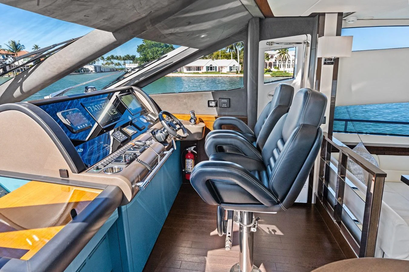 The helm station offers a sleek and modern command center with panoramic views. aboard IT'S ENOUGH Yacht for Sale