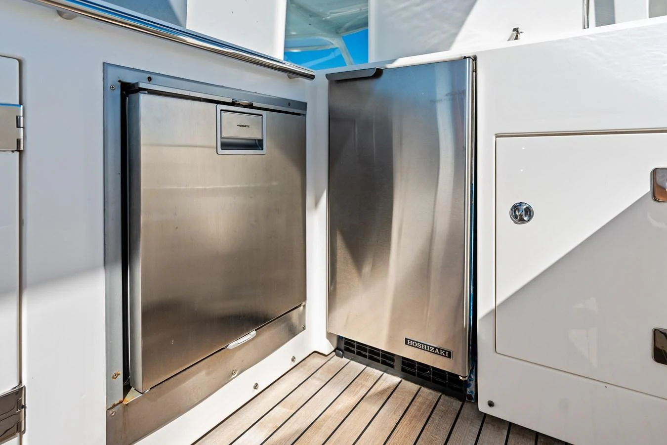 The image showcases stainless steel appliances in the yacht's galley area. aboard IT'S ENOUGH Yacht for Sale
