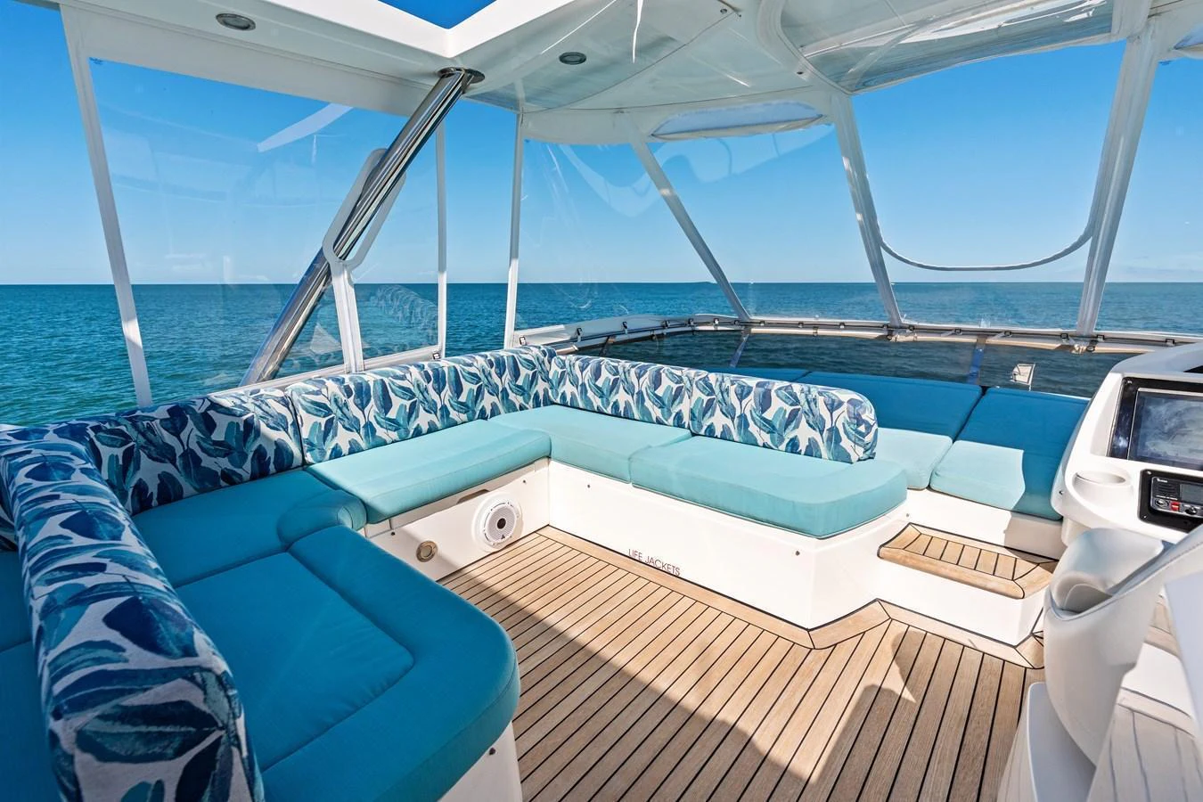 The flybridge offers a spacious seating area with panoramic ocean views. aboard IT'S ENOUGH Yacht for Sale