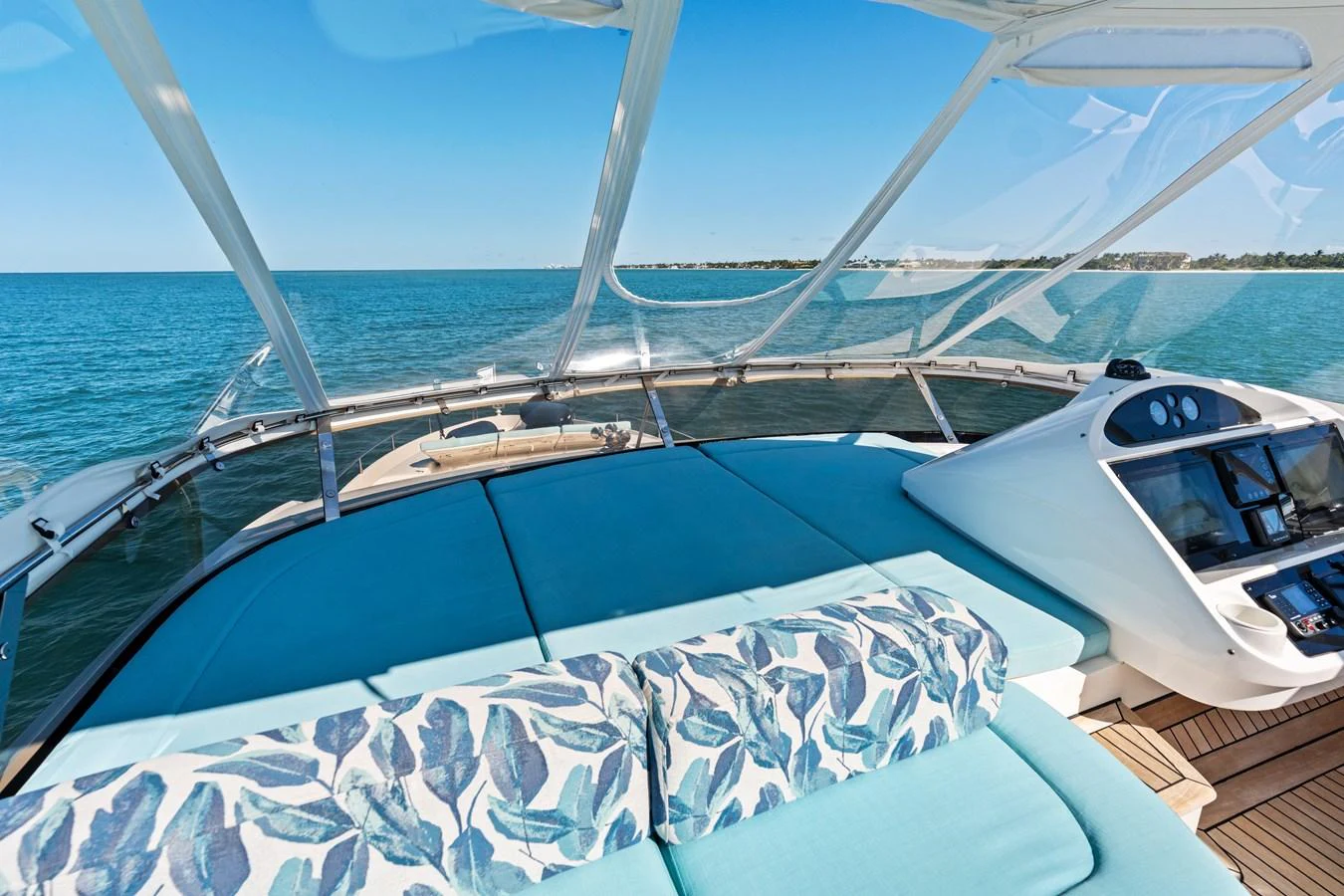 The flybridge offers a spacious lounging area with panoramic ocean views. aboard IT'S ENOUGH Yacht for Sale