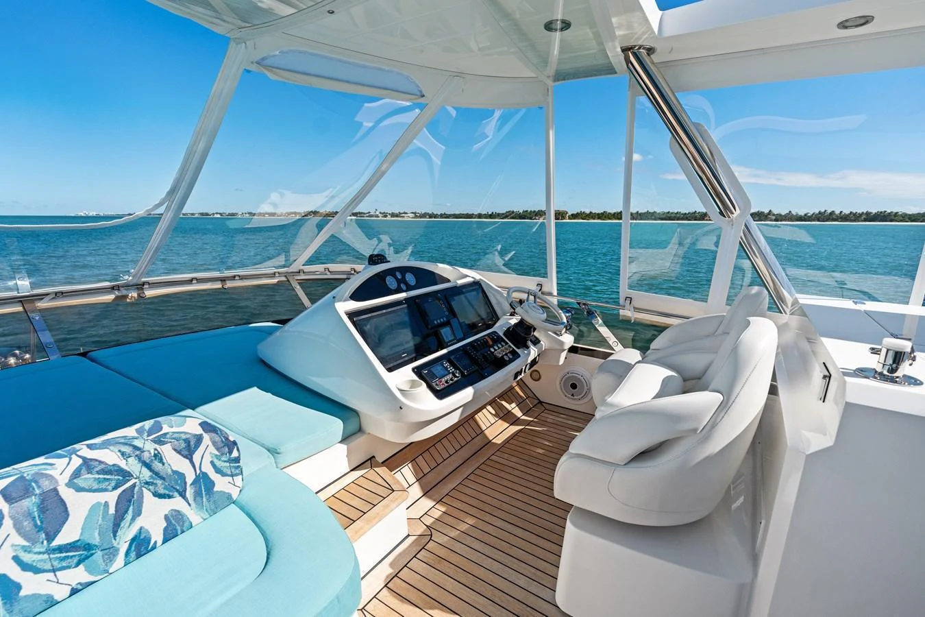 The helm area offers a luxurious and comfortable space with stunning views of the water. aboard IT'S ENOUGH Yacht for Sale
