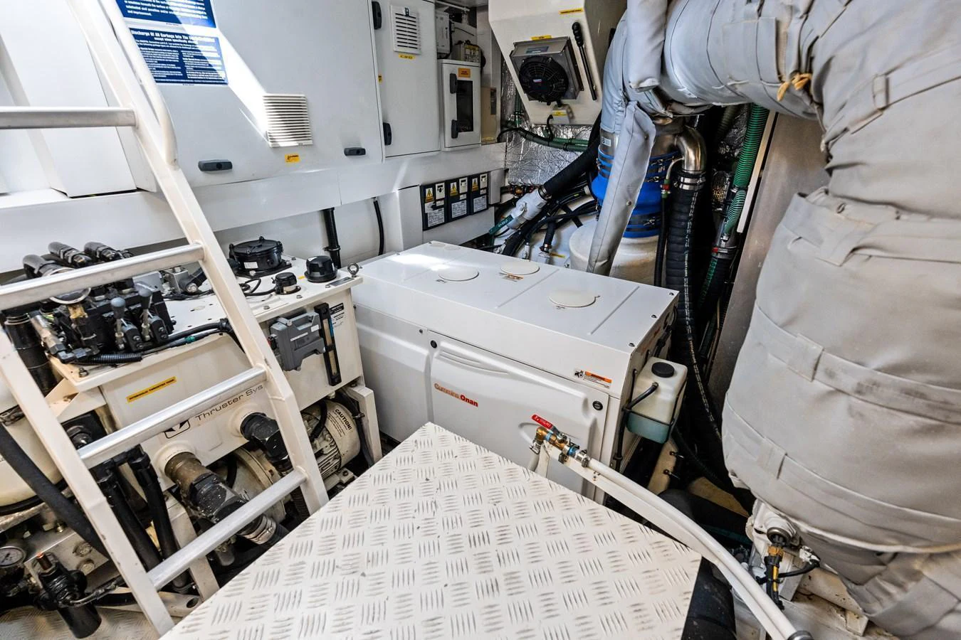 The image showcases the yacht's engine room with various mechanical components and equipment. aboard IT'S ENOUGH Yacht for Sale