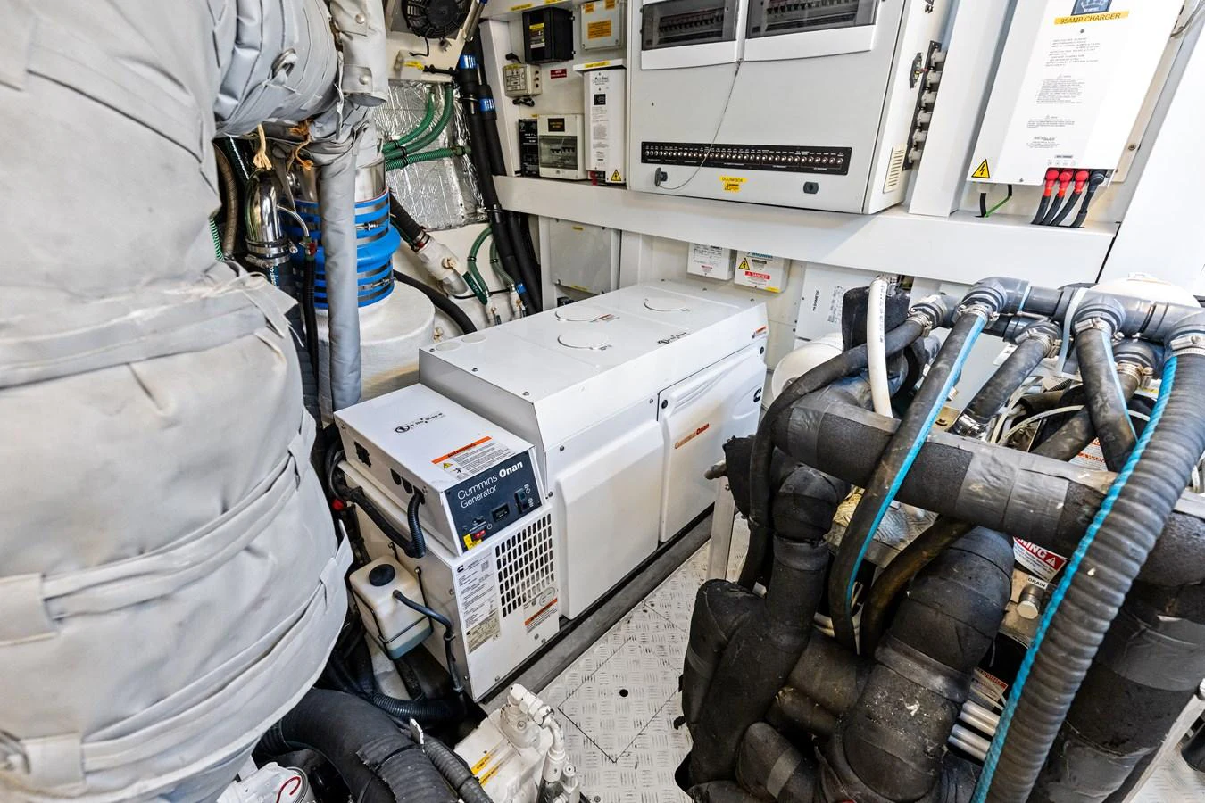 The image showcases the yacht's engine room with various machinery and equipment. aboard IT'S ENOUGH Yacht for Sale