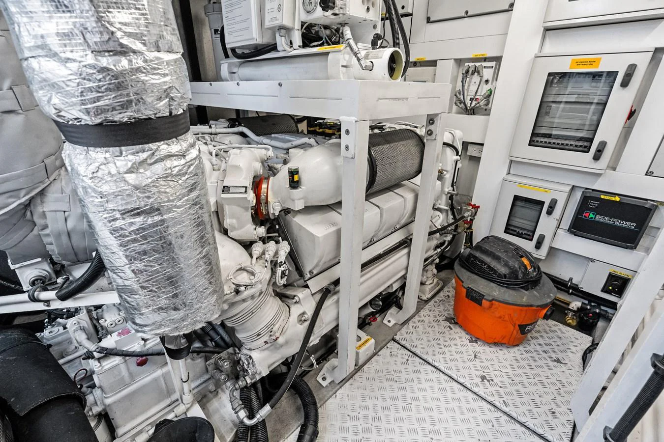 The yacht's engine room showcases advanced machinery and equipment for optimal performance. aboard IT'S ENOUGH Yacht for Sale