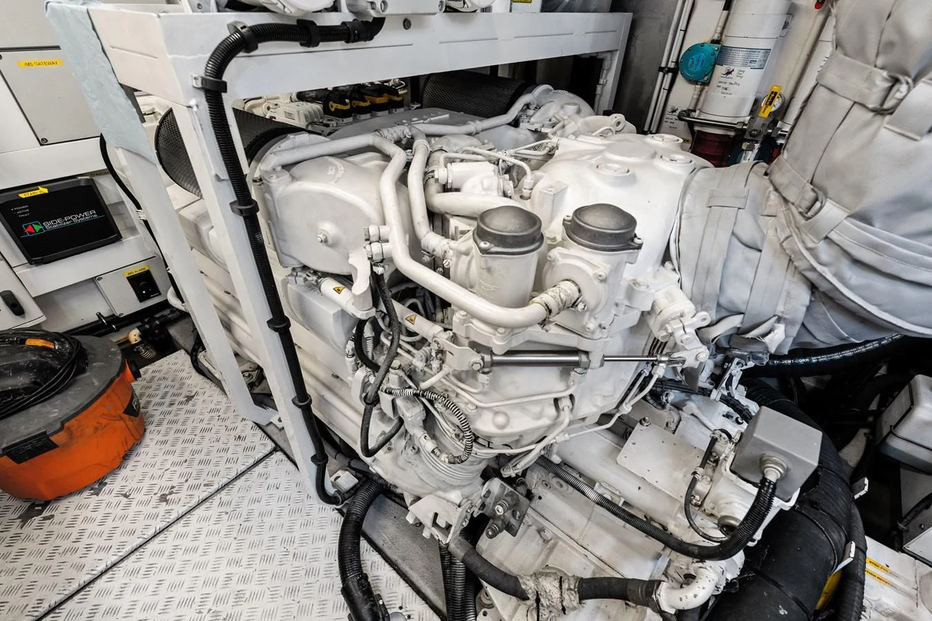 The image showcases the yacht's engine room with detailed machinery and equipment. aboard IT'S ENOUGH Yacht for Sale