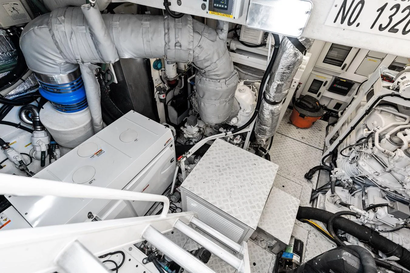 The image showcases the yacht's engine room with various mechanical components and equipment. aboard IT'S ENOUGH Yacht for Sale