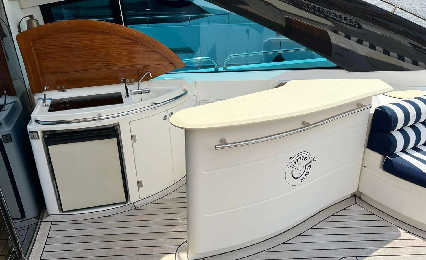 The yacht features a sleek bar area with a countertop and built-in appliances, perfect for entertaining guests. aboard TIMELESS C Yacht for Sale