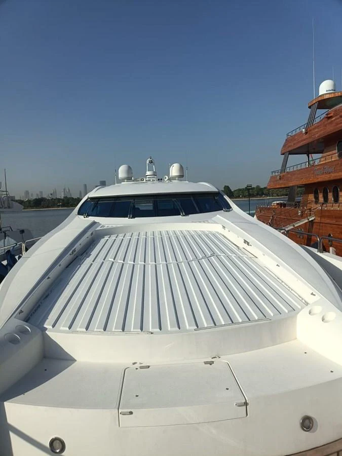 The yacht's sleek exterior showcases a spacious foredeck with a clean, modern design. aboard TIMELESS C Yacht for Sale
