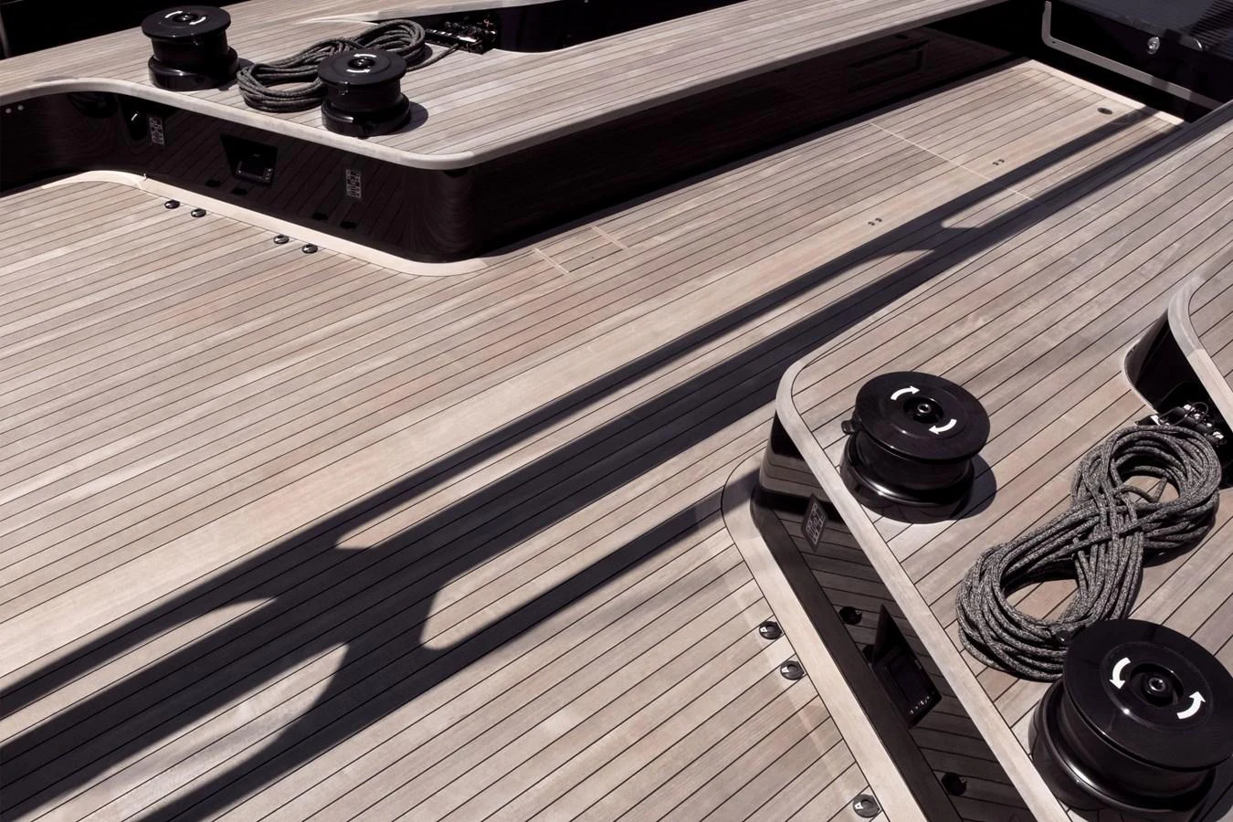 The image showcases the sleek and modern deck of a yacht, highlighting its clean lines and high-quality materials. aboard BULLITT Yacht for Sale