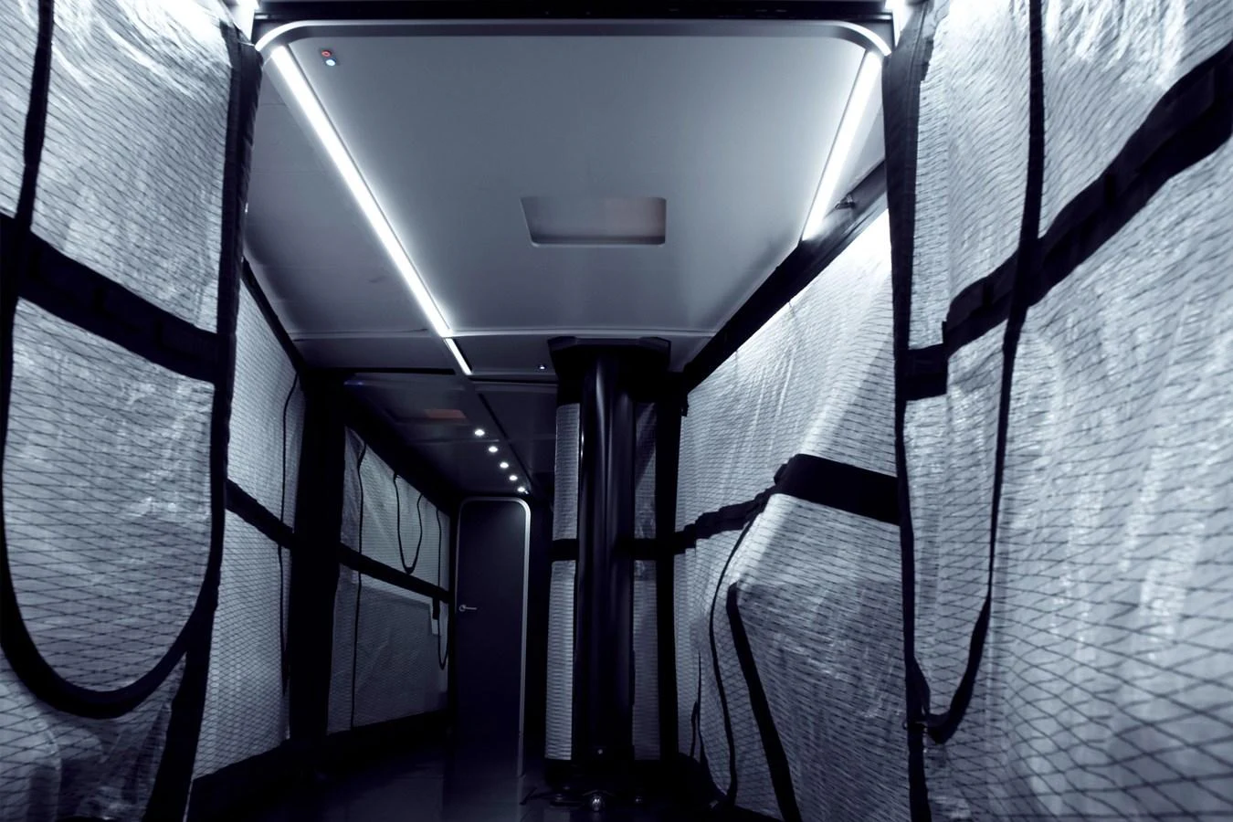 The image showcases a modern, sleek interior passageway with a futuristic design. aboard BULLITT Yacht for Sale