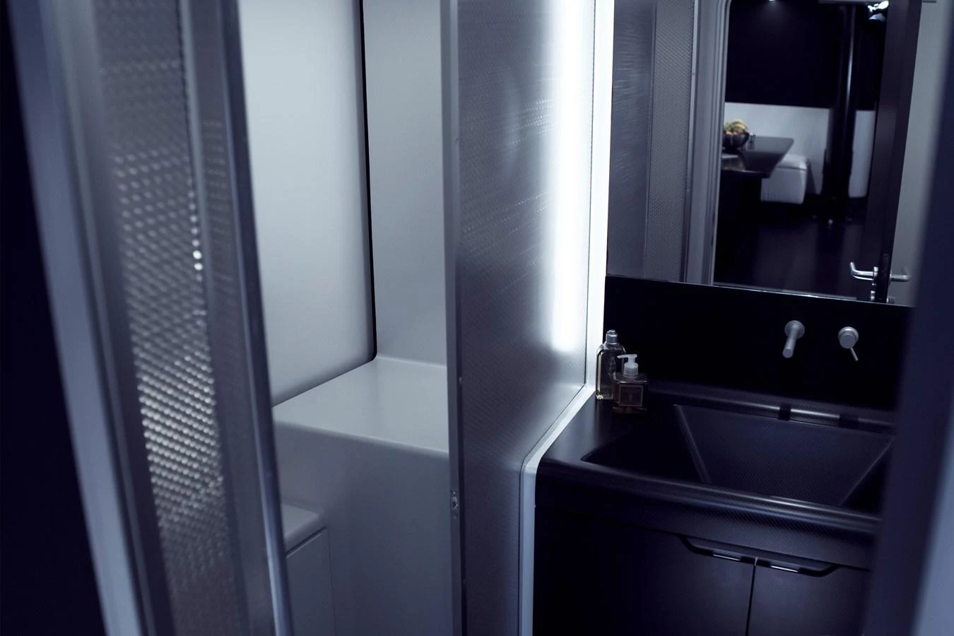 The image showcases a sleek and modern bathroom area within the yacht. aboard BULLITT Yacht for Sale