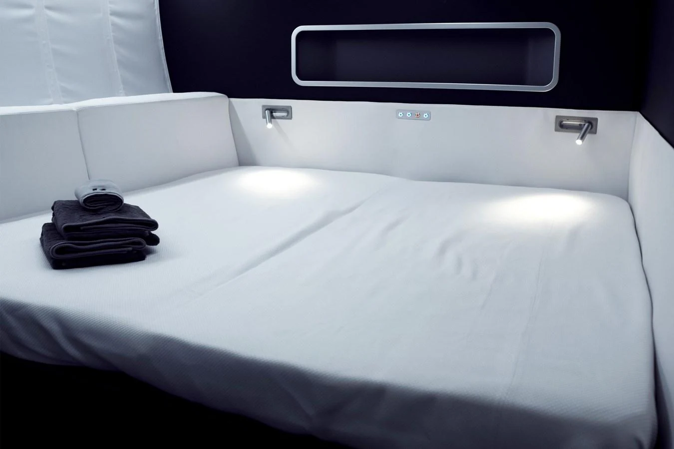 The stateroom features a sleek, modern design with a comfortable bed and ambient lighting. aboard BULLITT Yacht for Sale