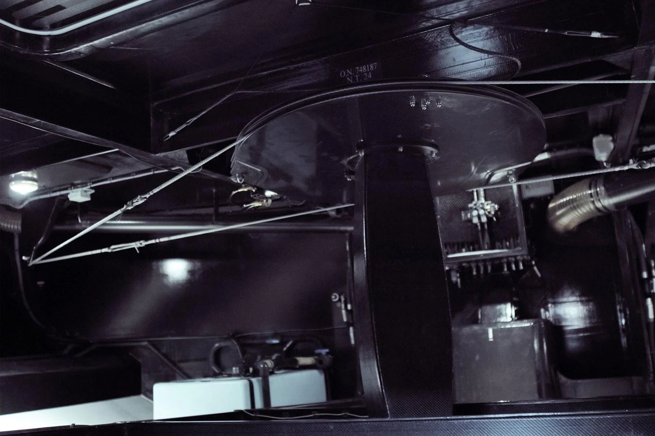 A close-up view of the yacht's mechanical and structural components in a dark setting. aboard BULLITT Yacht for Sale