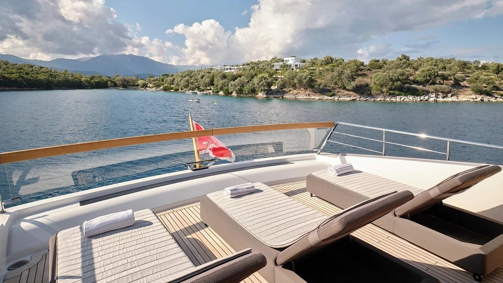 The sundeck offers a serene space with comfortable loungers and a stunning view of the surrounding waters. aboard SAHASA I Yacht for Sale