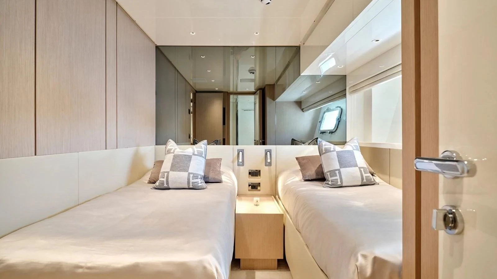 The twin stateroom offers a serene and comfortable sleeping area with modern decor and ample natural light. aboard SAHASA I Yacht for Sale