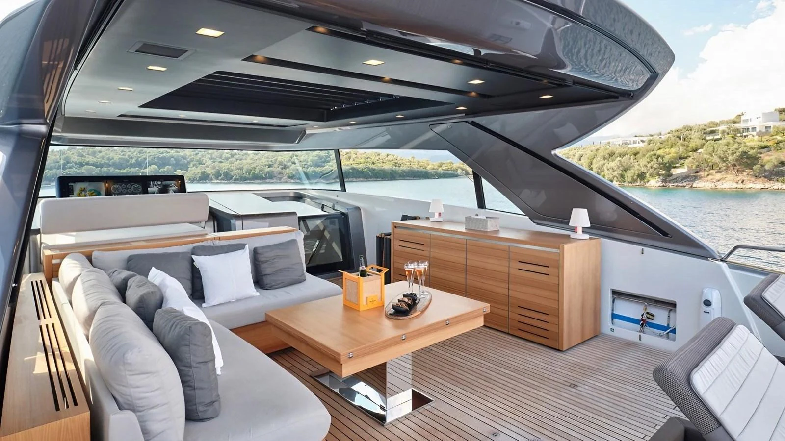 The aft deck features a luxurious seating area with a modern design and stunning views. aboard SAHASA I Yacht for Sale